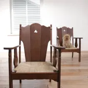 Pair of low Brutalist oak lounge chairs with new rush seats – circa 1935