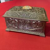 Ancient box made of chiseled metal and stone