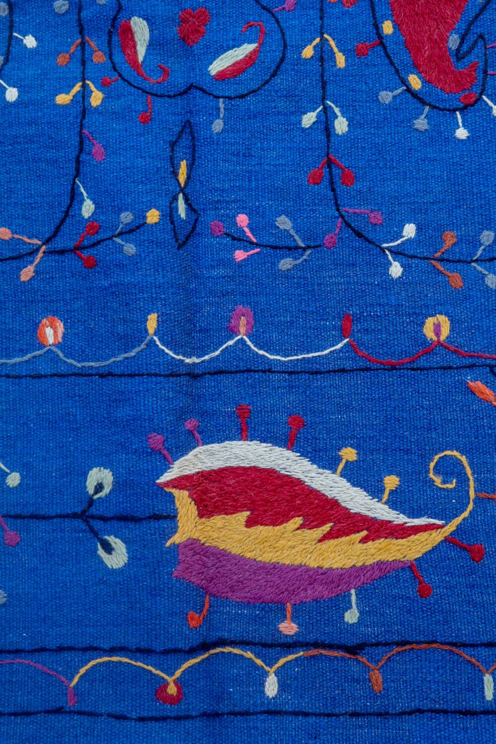 Midnight blue suzani kilim rug with embroidered patterns