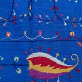 Midnight blue suzani kilim rug with embroidered patterns