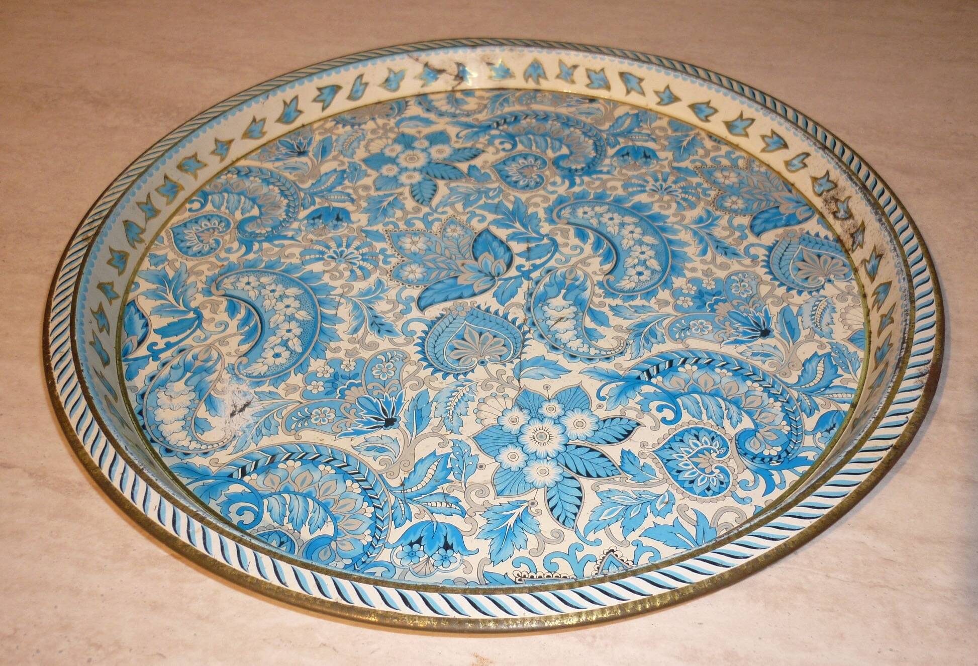 Blue cashmere round tray on white background.