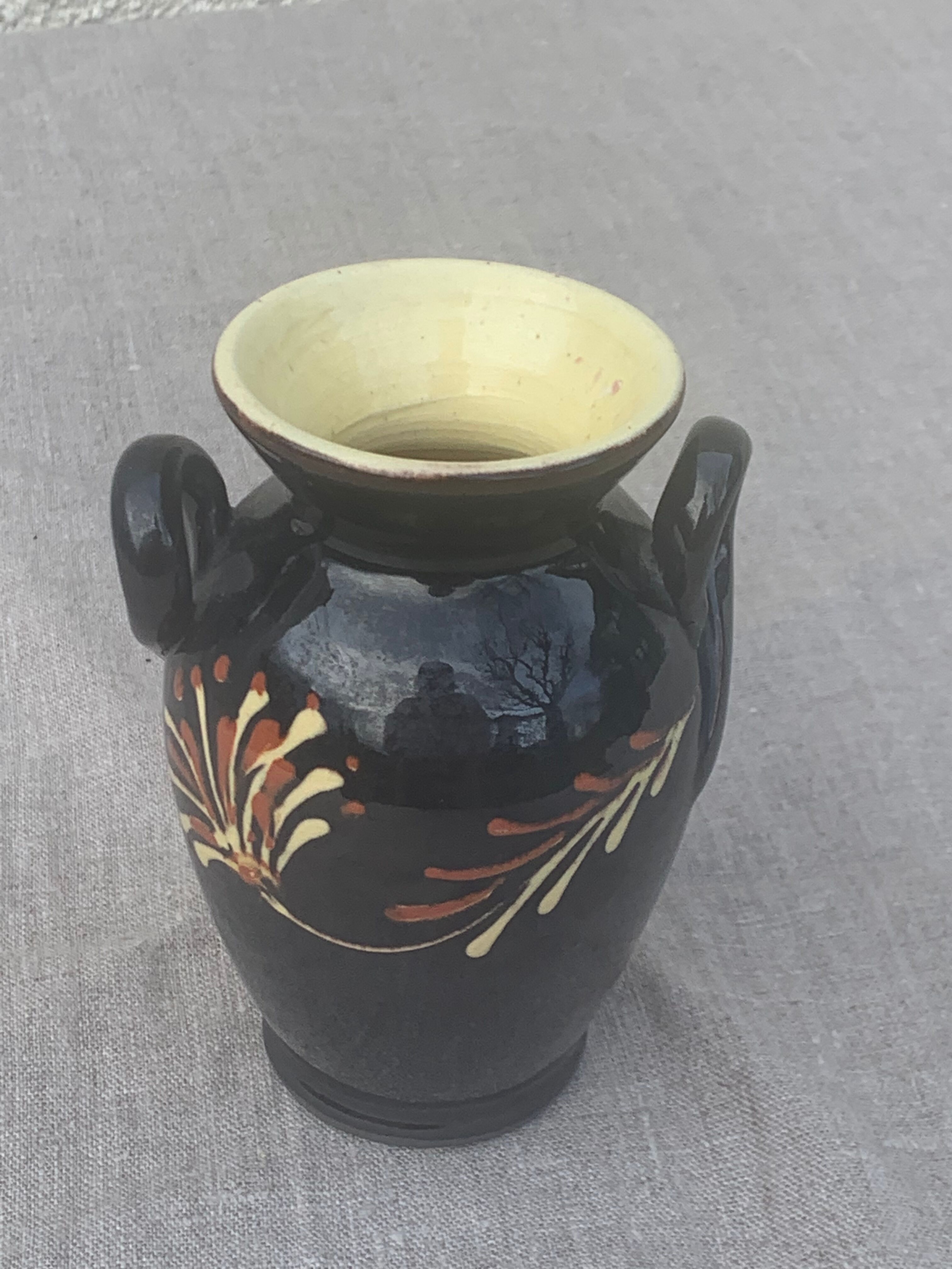 Vintage hand-painted yellow and black glazed ceramic amphora vase
