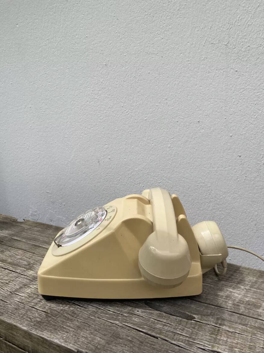 Vintage beige rotary telephone