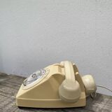 Vintage beige rotary telephone