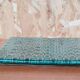 Green earthenware trivet