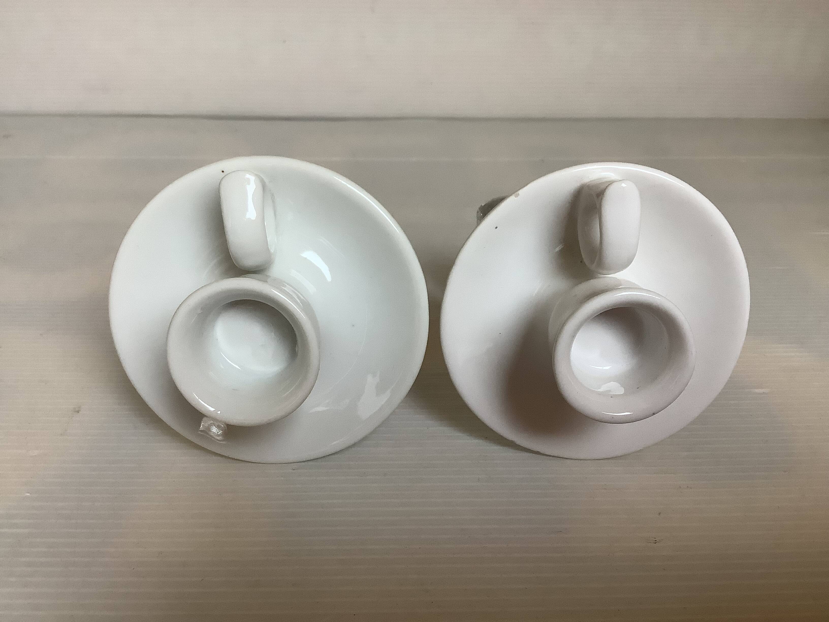 Pair of small white cellar rat candlesticks