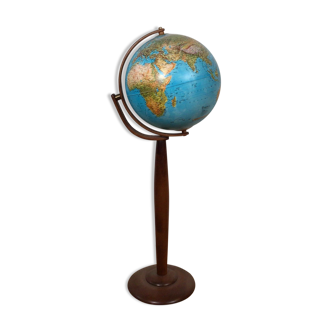 Illuminated globe on wooden feed