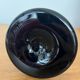 Artisanal vase in black glass with copper and blue inclusions.
