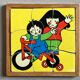 Wooden frame puzzle from the 60s/70s depicting two children on bicycles.