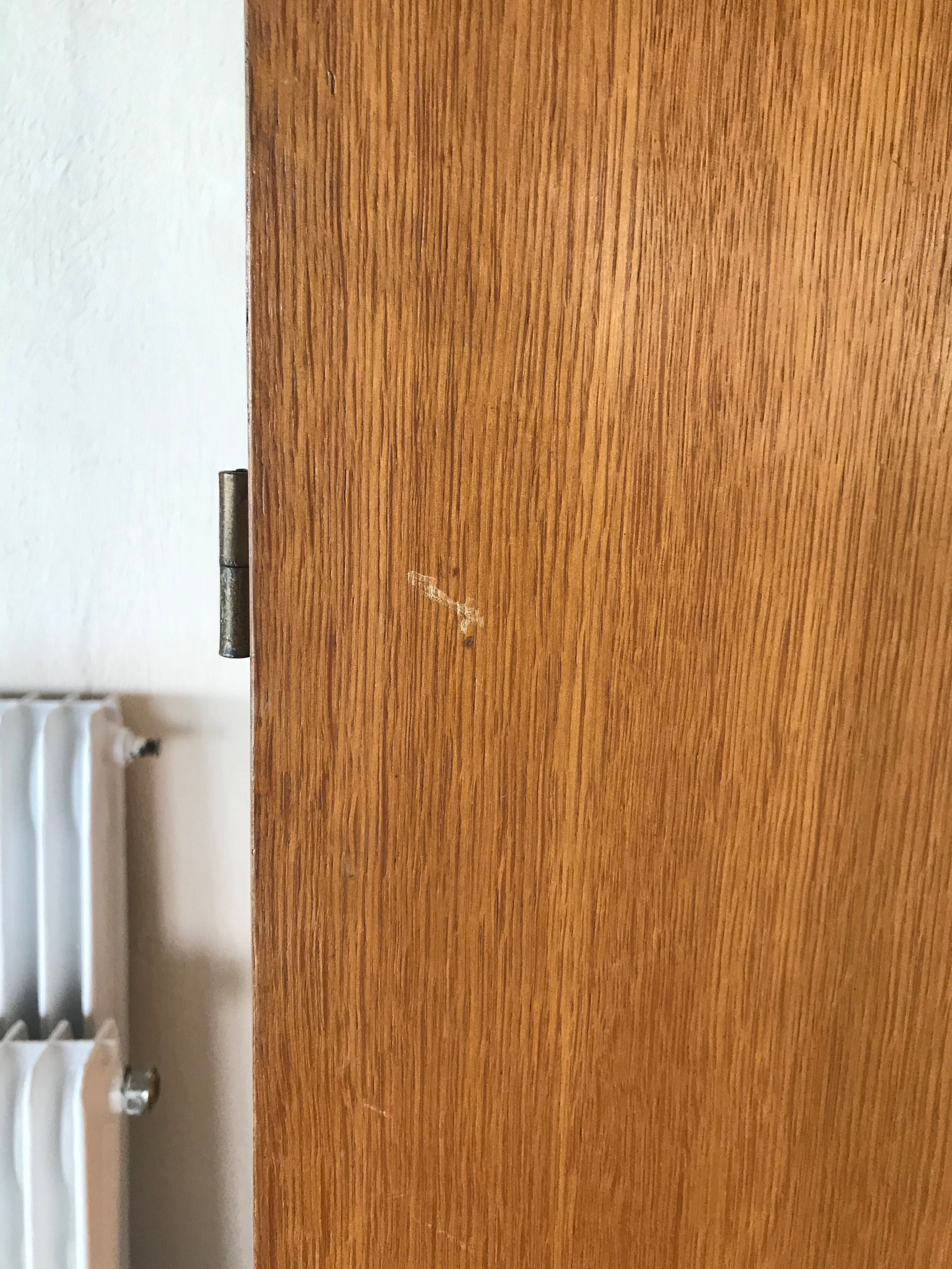 Scandinavian-style wooden cabinet with mirror