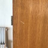 Scandinavian-style wooden cabinet with mirror