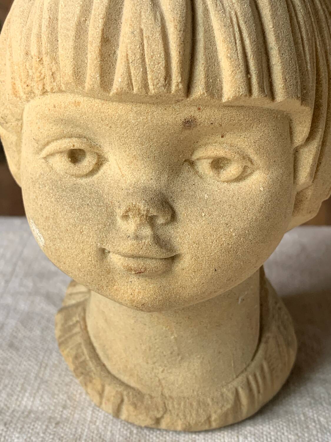 Stone bust of a little girl