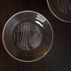 Hermès pair of glass plates with a dolphin pattern.