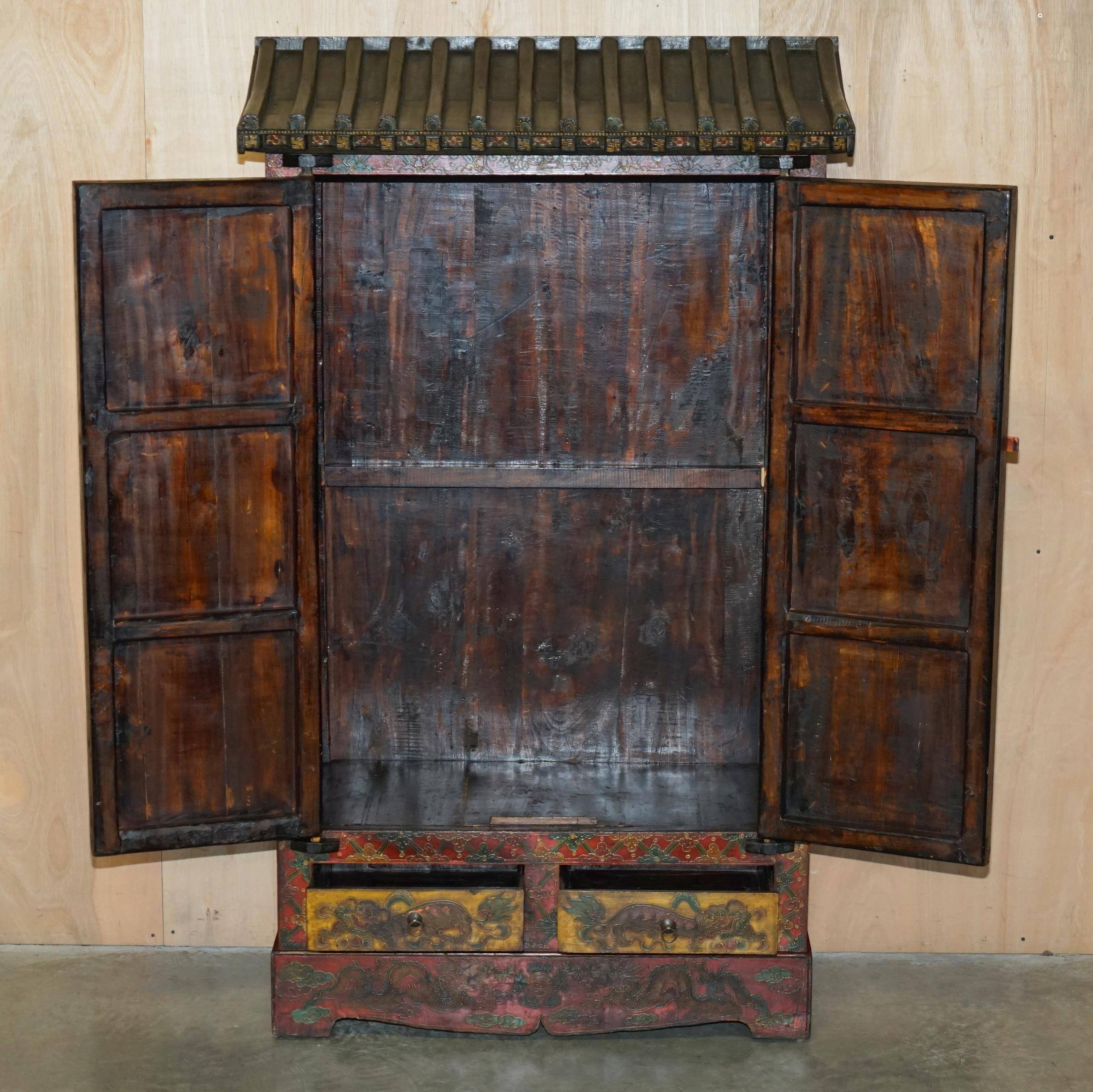 Vintage Chinese wardrobe painted with pagoda and drawers.