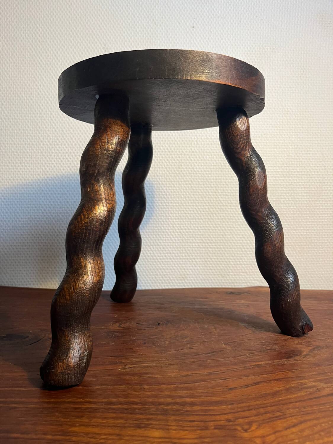 Round wooden tripod stool