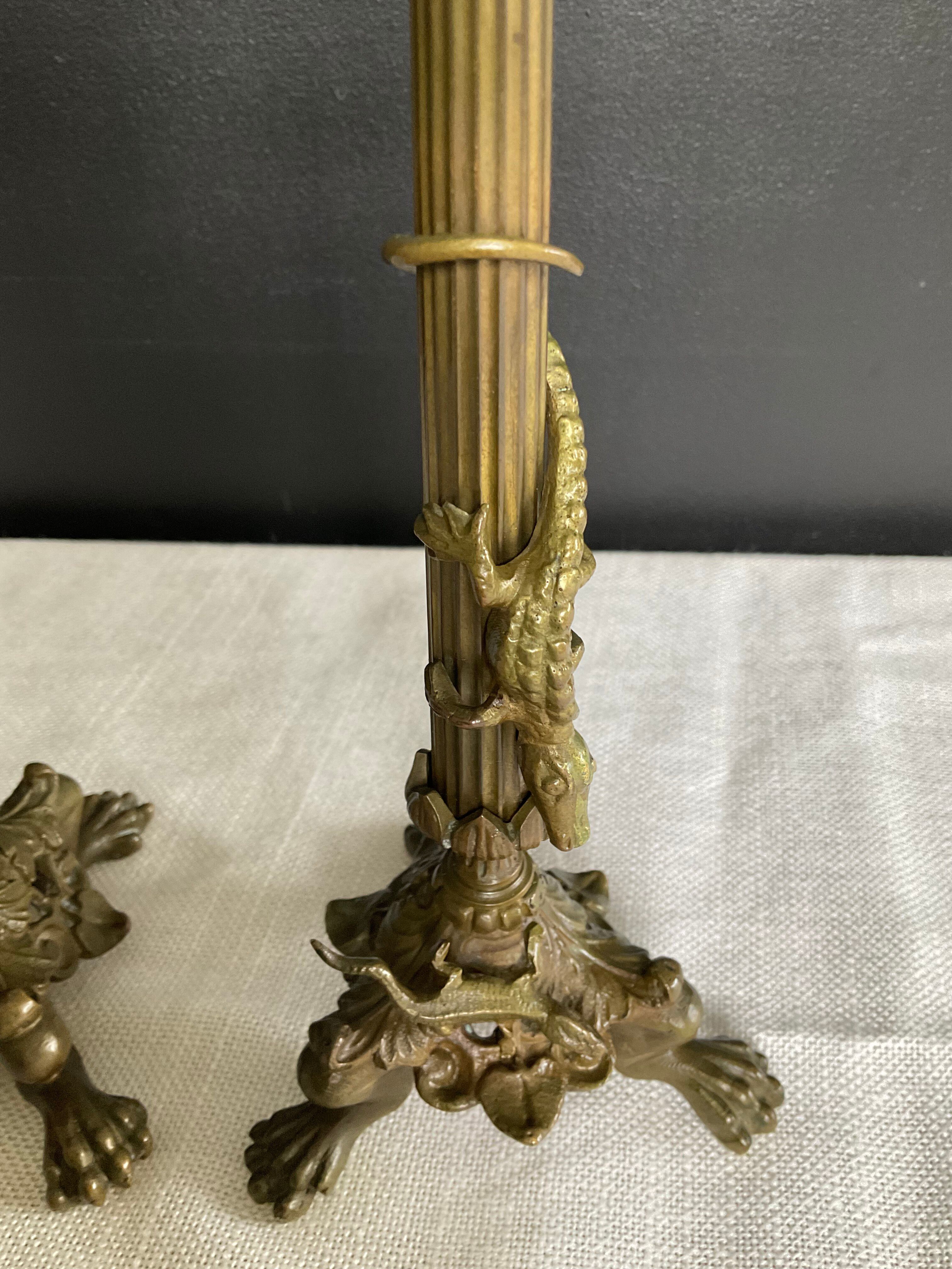 Pair of 19th-century gilded bronze candlesticks in Empire style.