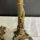 Pair of 19th-century gilded bronze candlesticks in Empire style.