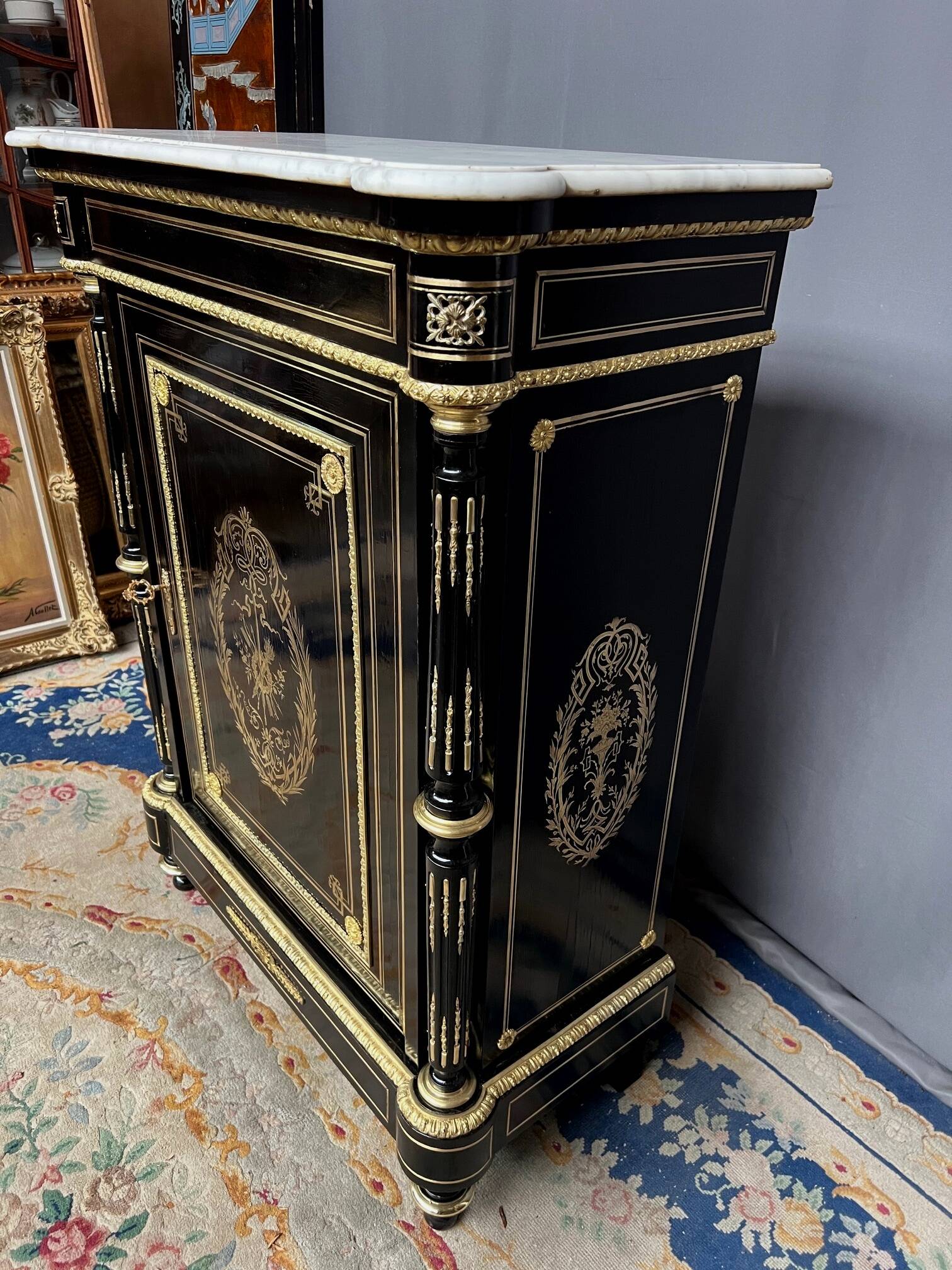 Napoleon III style commode, decorated with brass marquetry and gilded bronze mounts.