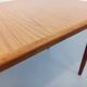 Rectangular dining table in vintage Scandinavian style made of teak and melamine.