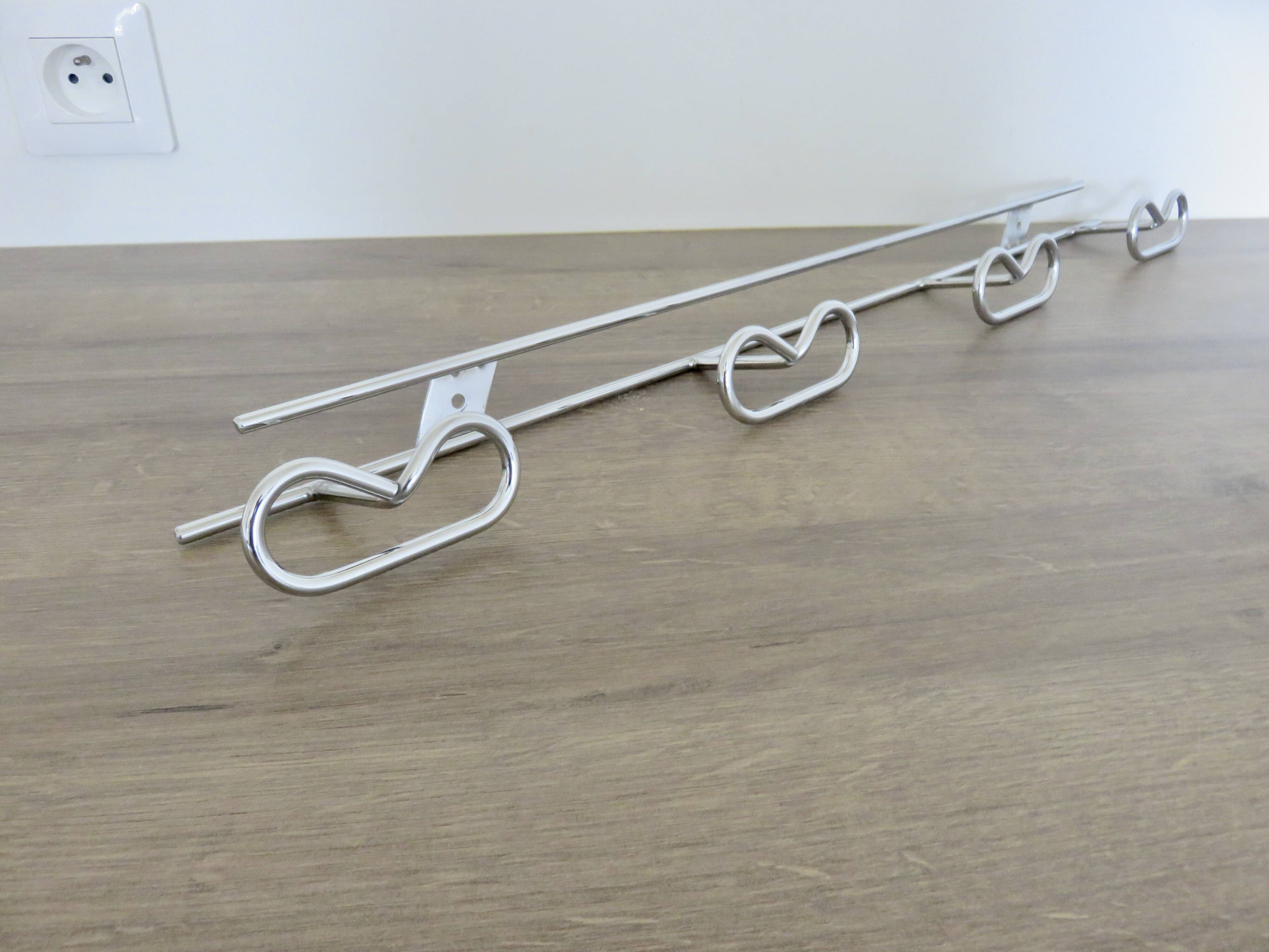 Large vintage wall-mounted coat rack in chrome metal