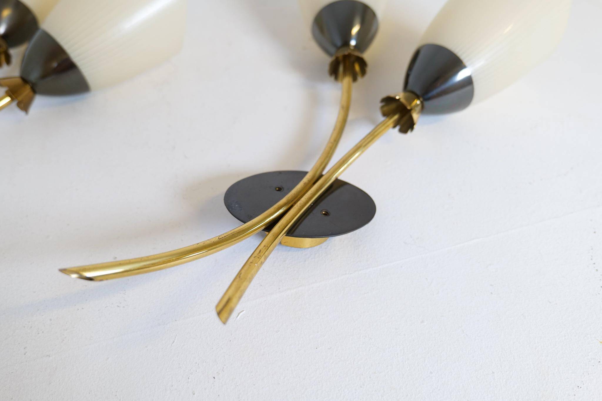 Mid-century pair of wall lamps in brass and opaline attributed to Asea Sweden, 1950s.