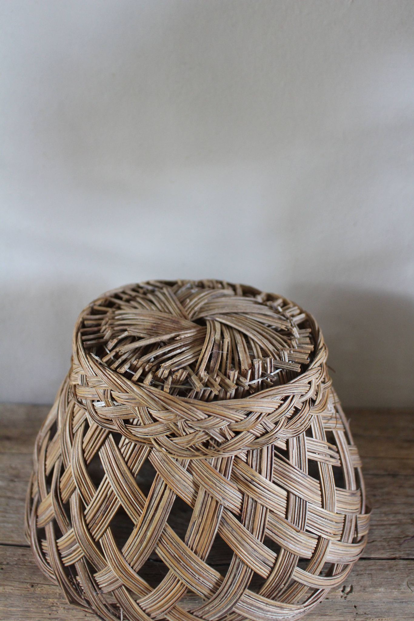 Vintage high round wicker basket with openwork.