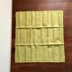 Old embroidered green square table napkin with cutwork