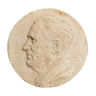 Old plaster medallion, man profile