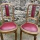 Pair of studded burgundy leather Art Deco chairs