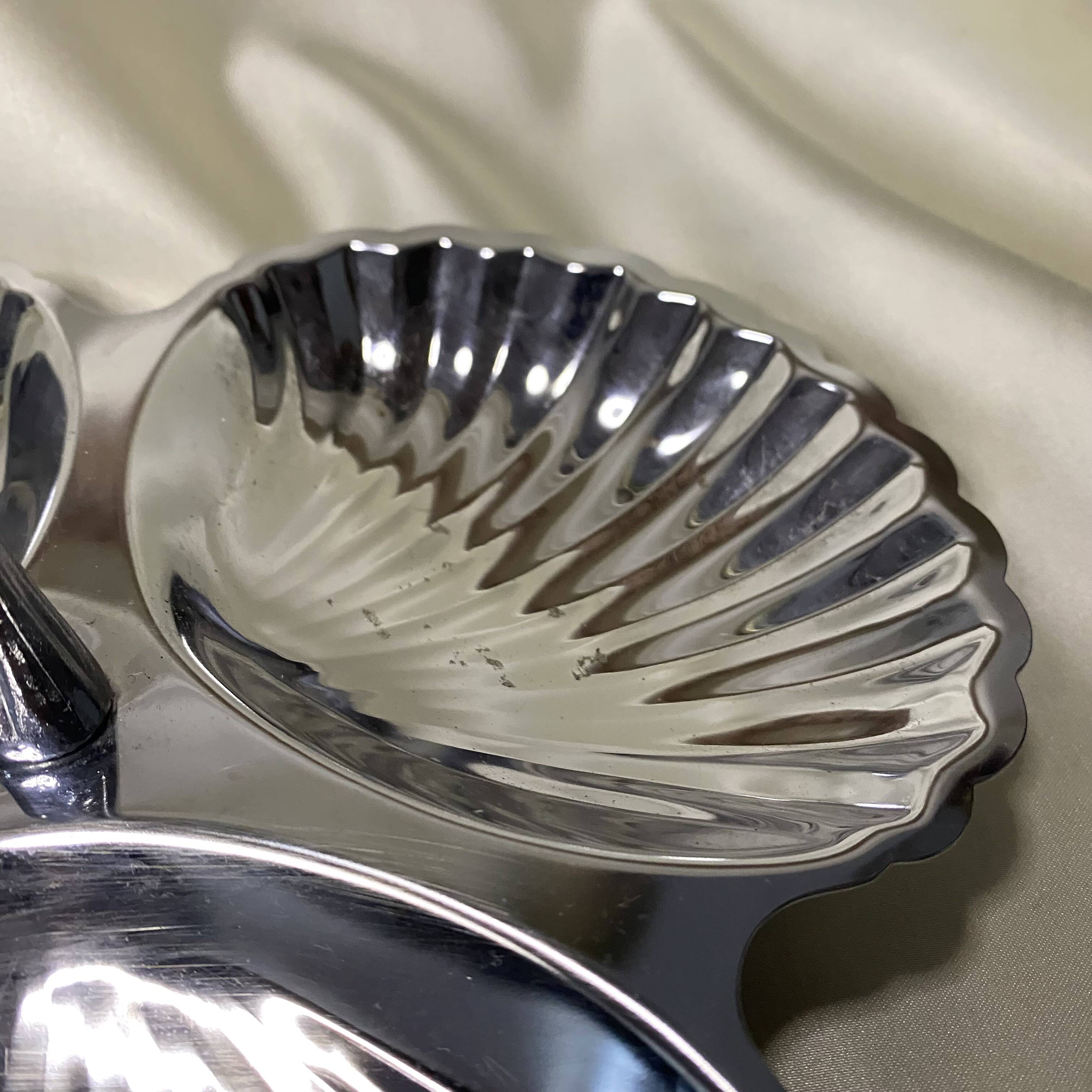 Stainless steel serving platter in the shape of seashells