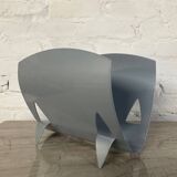 Designer log holder in enameled sheet metal
