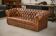 Tan leather tufted Chesterfield sofa