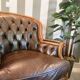 Pair of vintage Chesterfield club armchairs in brown tufted leather –