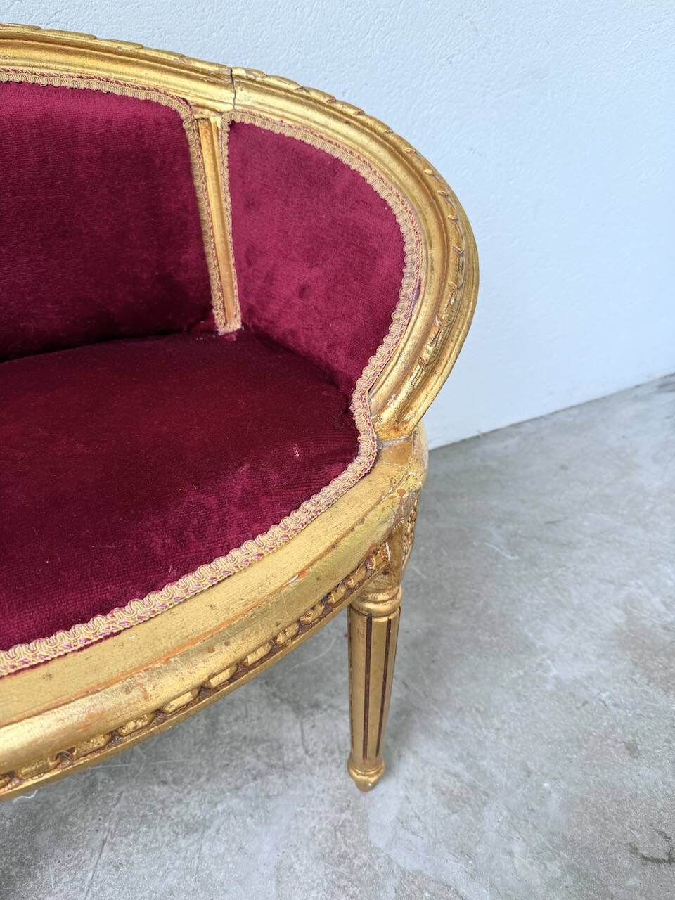 Louis XVI gilt wood and red velvet armchair