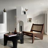 Reclined armchair in canned teak in natural wood
