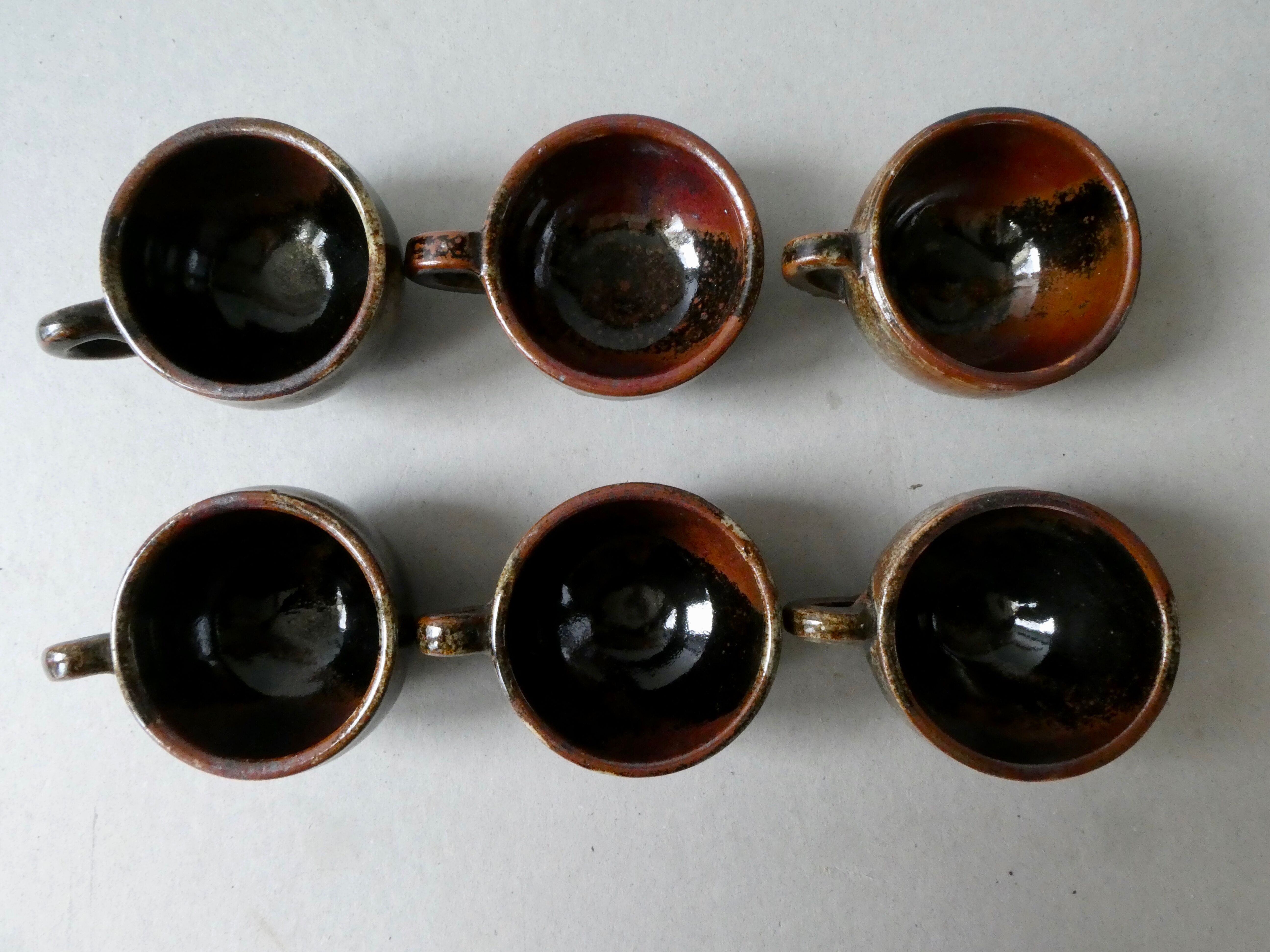6 cups, 1 sugar bowl and 1 milk pot, made of sandstone by Isabelle Roger and Pierre Bernier