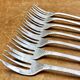 7 Christofle silver-plated oyster forks with Louis crossed ribbons