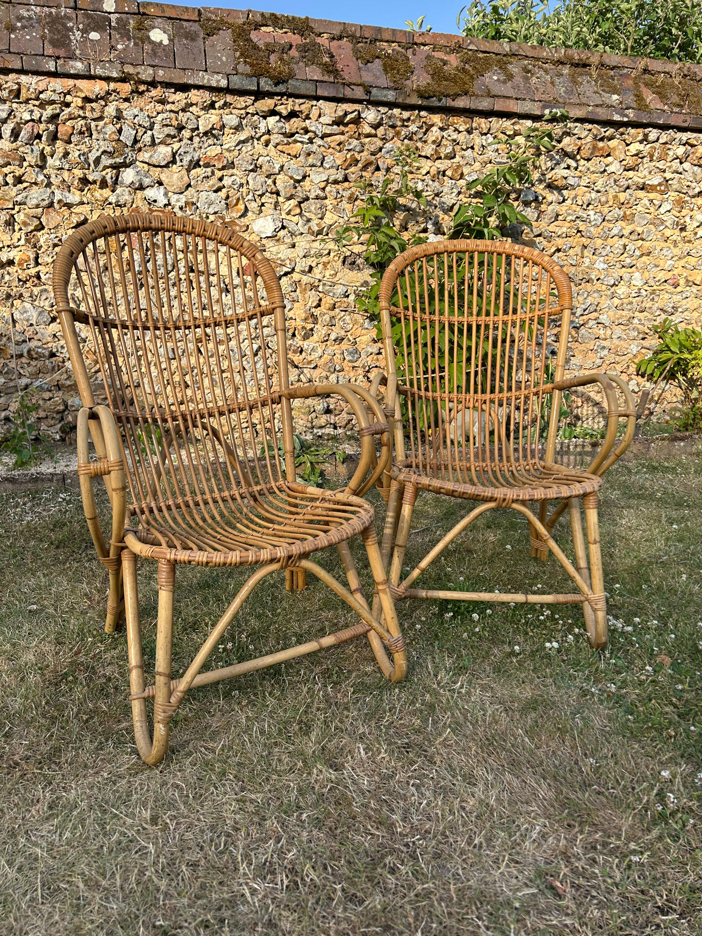 Pair of vintage rattan armchairs from the 1960s.