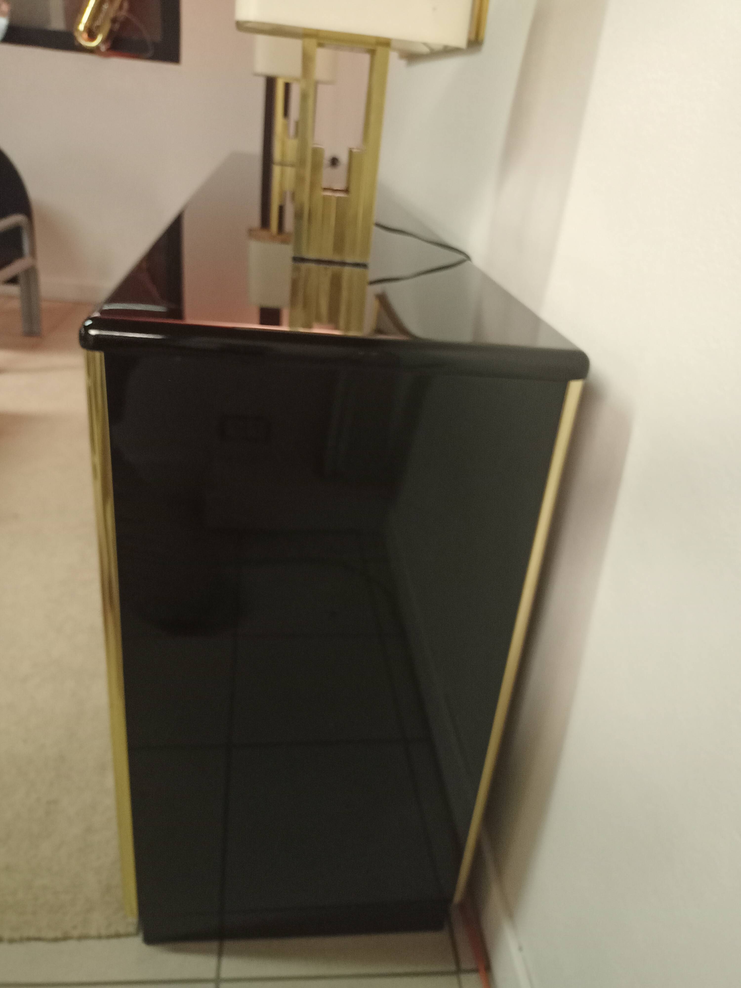 Black lacquered and brass design 70/80