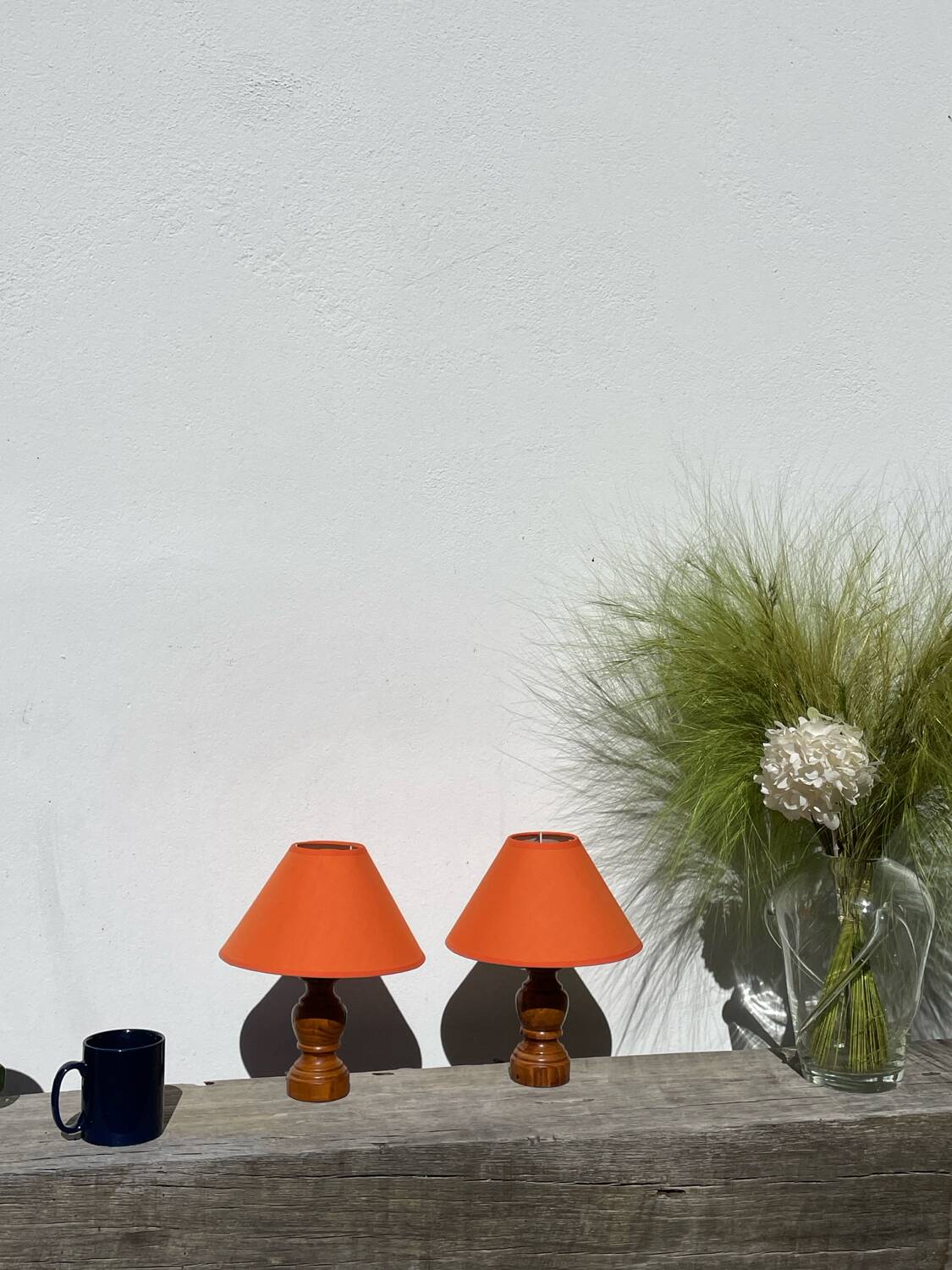 Pair of orange turned wood lamps