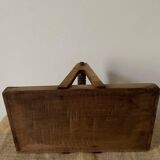 Tray with worked wooden handle.