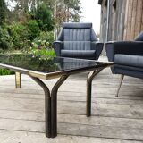 Vintage golden 70s coffee table and space age smoked glass