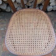 Curved wooden bistro chair with caning