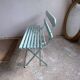 Former folding garden bench with wooden and metal slats