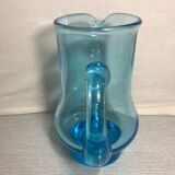Old blue blown glass pitcher with vintage handle