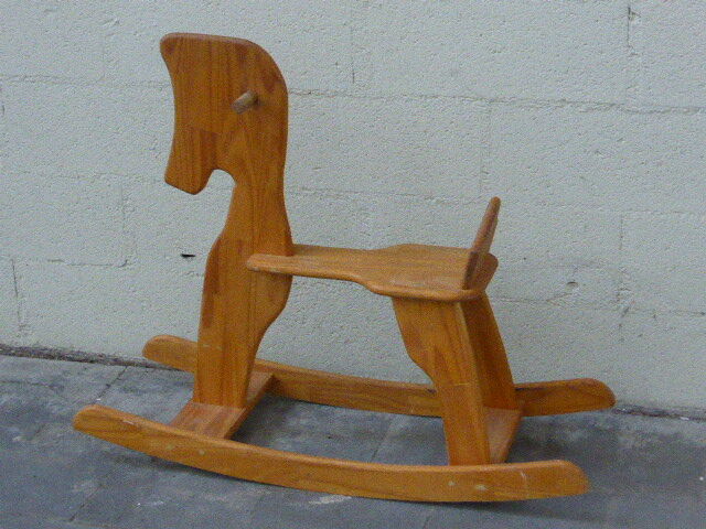 Horse rocking in pine