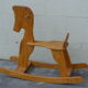 Horse rocking in pine