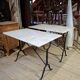 Pair of bistro tables in marble and cast iron.