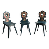 Set of 3 vintage wooden accent chairs painted navy blue, with 1920s decorated backs.