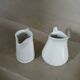2 small white porcelain pitchers